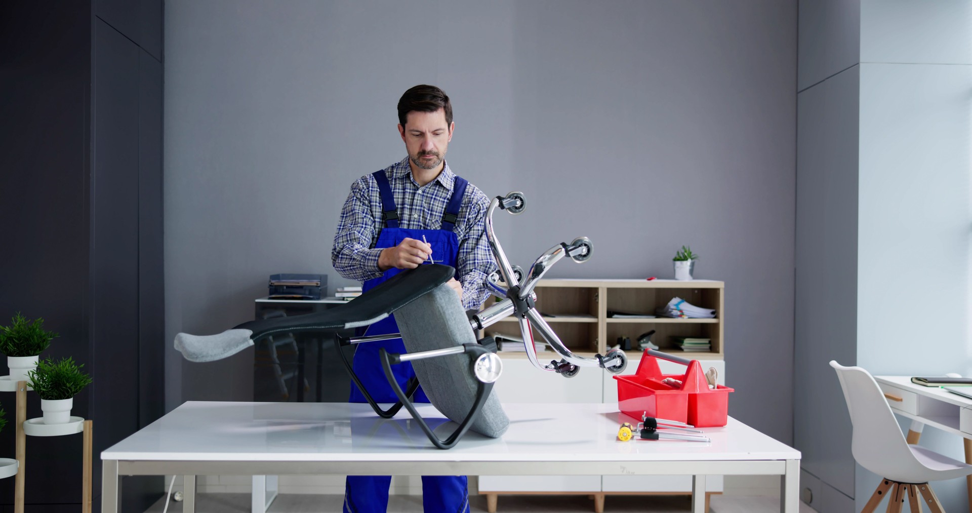 Office Chair Assembling And Repair. Man Working